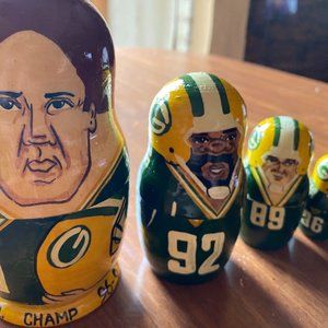 Russian hand made and wooden crafted nesting doll: American football players